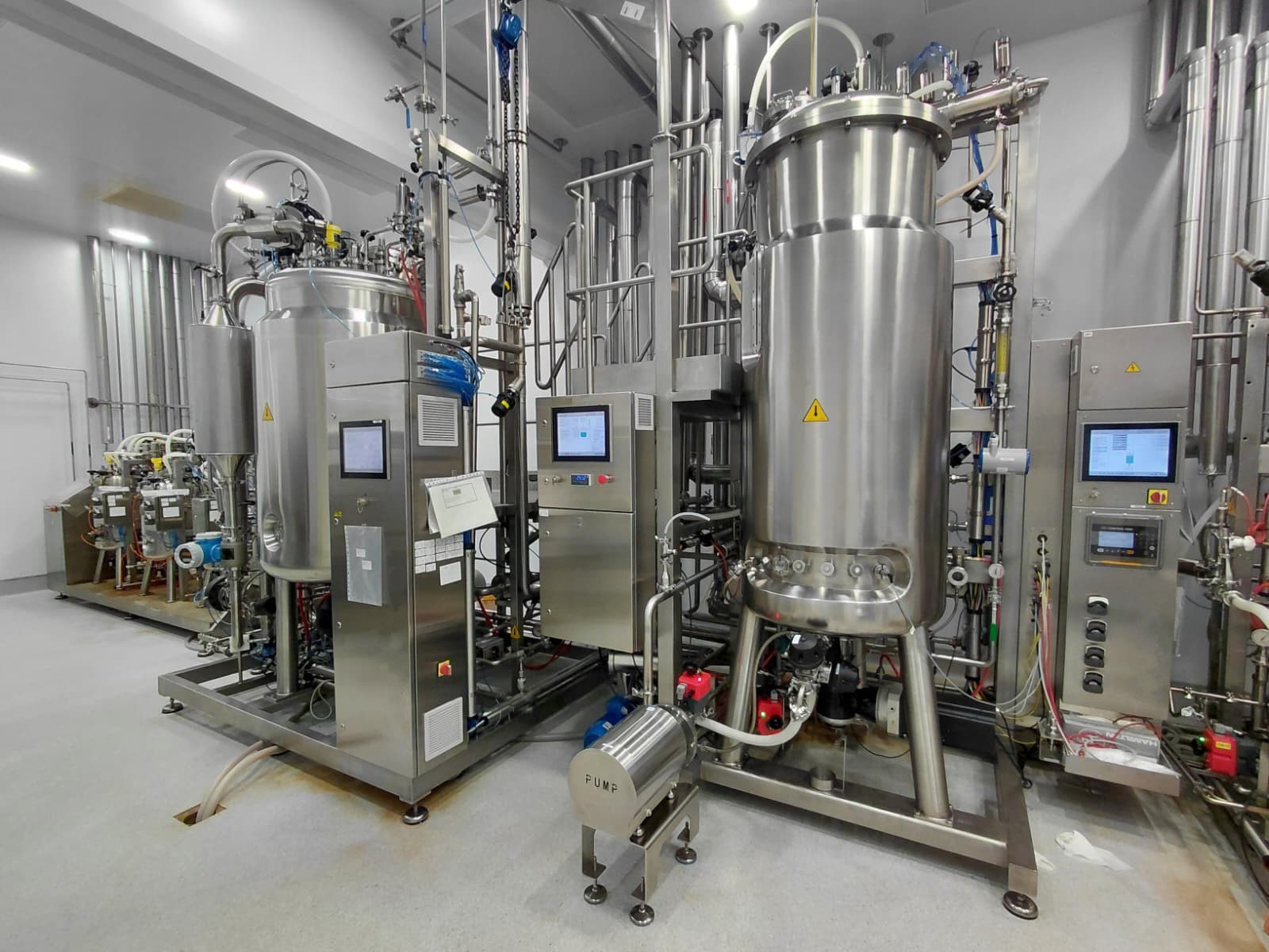 Industrial bioprocess installation with stainless-steel equipment, hygienic piping and instrumentation